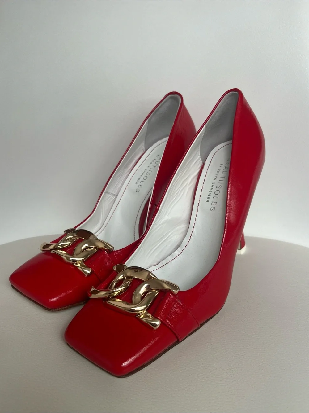 Vero Cuoio Red Patent Pumps with Gold Chain Accent